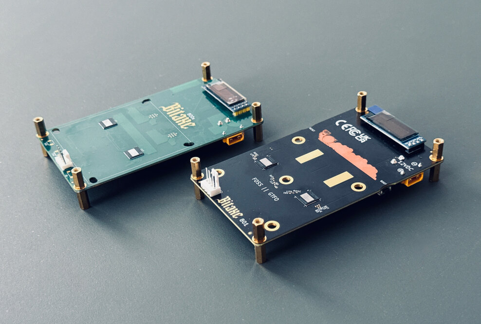 The Bitaxe GT Prototype and the final product, the Bitaxe GT 801.
